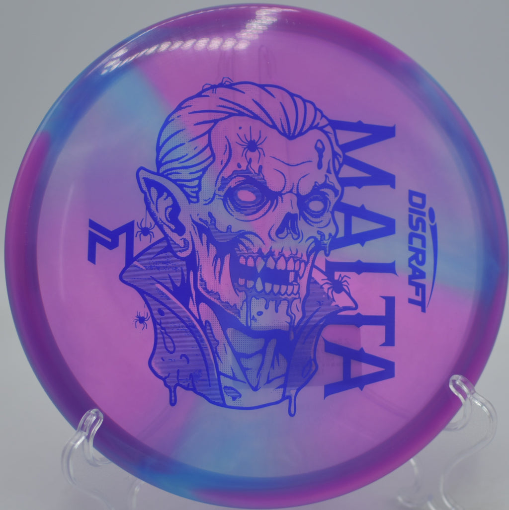 Paul McBeth Z Swirl “Dracul” Malta gliding on a smooth hyzer line at Tom Brown Park Disc Golf Course in Tallahassee, Florida.