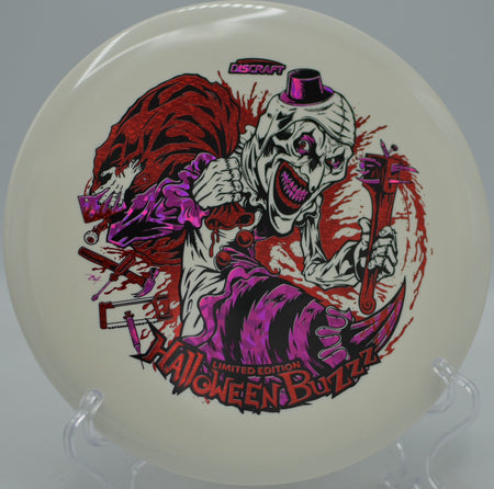 Discraft Halloween Glo Triple Stamped Buzzz 2025 edition flying straight at Harmony Bends Disc Golf Course in Columbia, Missouri.