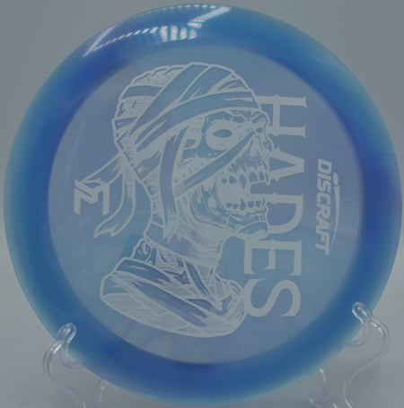 Discraft Z Swirl Mummified Hades gliding on a long turnover drive at Fountain Hills Disc Golf Course in Fountain Hills, Arizona.