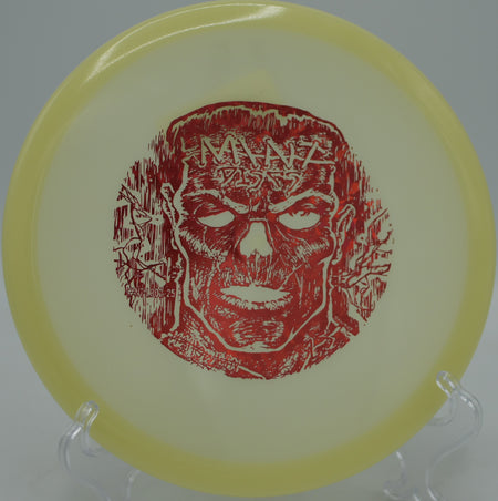 Mint Discs Nocturnal Glow Lobster sailing on a glowing hyzer-flip line under blacklight at Maple Hill Disc Golf Course in Leicester, Massachusetts.