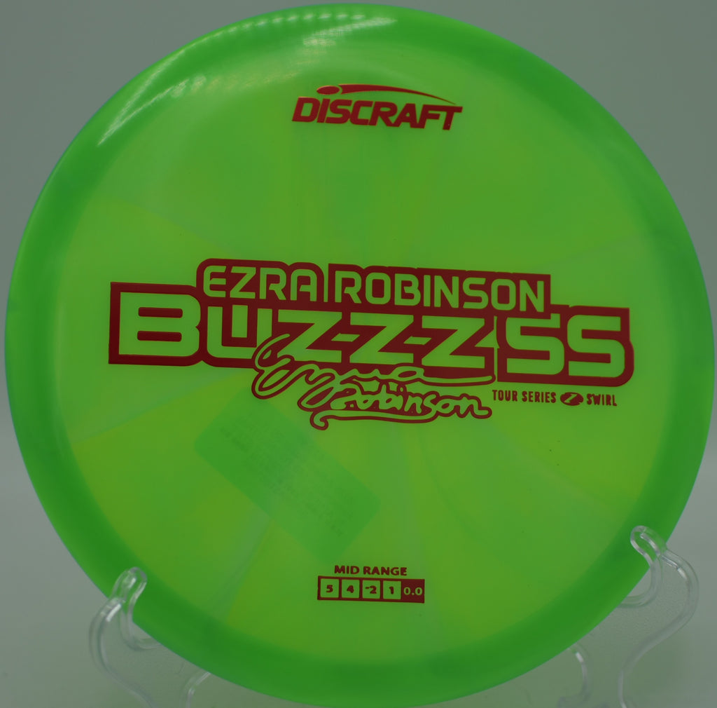 Discraft Ezra Robinson Z Swirl Buzzz SS 2025 on a glidey approach at Veterans Park Disc Golf Course in Arlington, Texas.
