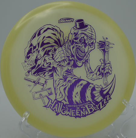 2025 Mega Glo Halloween Buzzz single stamp glowing across the fairway at North Boundary Disc Golf Course in Cranberry Township, Pennsylvania.