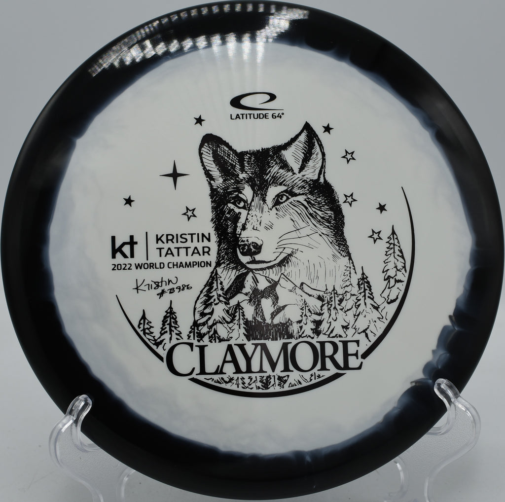 Gold Orbit Claymore Kristin Tattar Latitude 64° midrange trusted for hyzer flips at Blue Ribbon Pines Disc Golf Course in East Bethel, Minnesota.