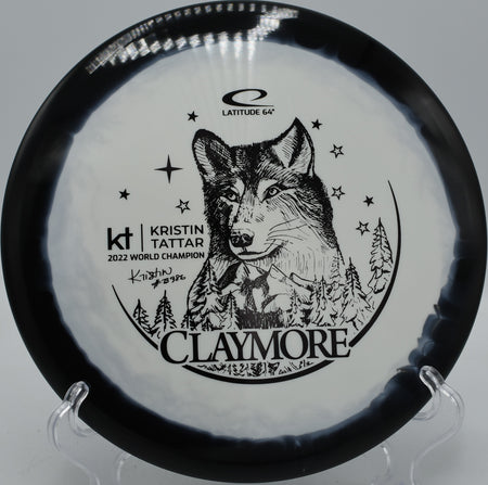 Gold Orbit Claymore Kristin Tattar Latitude 64° midrange trusted for hyzer flips at Blue Ribbon Pines Disc Golf Course in East Bethel, Minnesota.