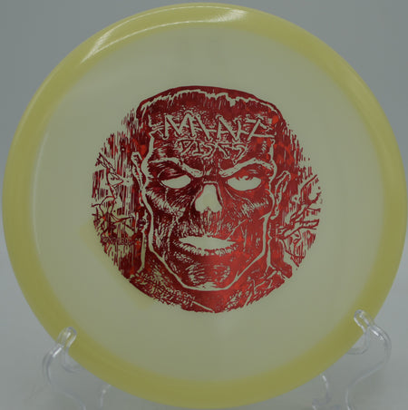 Halloween edition Mint Discs Lobster glowing bright on a late-night turnover shot at Blue Ribbon Pines Disc Golf Course in East Bethel, Minnesota.