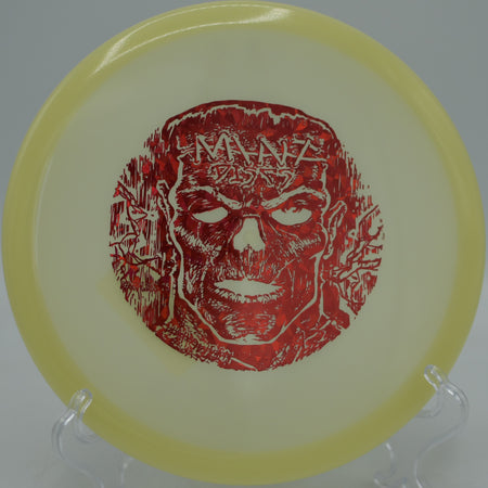 Glowing Nocturnal Lobster midrange carving a smooth turnover through the woods at Hornets Nest Disc Golf Course in Charlotte, North Carolina.