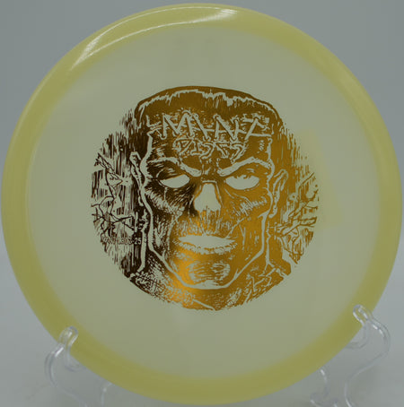 Glowing Nocturnal Lobster midrange carving a smooth turnover through the woods at Hornets Nest Disc Golf Course in Charlotte, North Carolina.