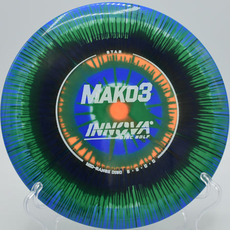 Brightly colored I-Dye Star Mako3 soaring on a glide-heavy flight at North Boundary Park Disc Golf Course in Cranberry Township, PA