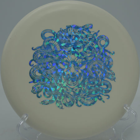 Hard Exo Lumen Link Medusa glow Discmania putter dropping softly into chains at DeLaveaga Disc Golf Course in Santa Cruz, California.