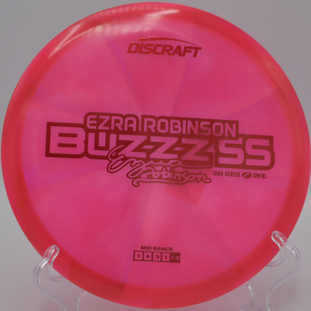 Z Swirl Buzzz SS Ezra Robinson 2025 parked after a straight midrange drive at Blue Ribbon Pines Disc Golf Course in East Bethel, Minnesota.