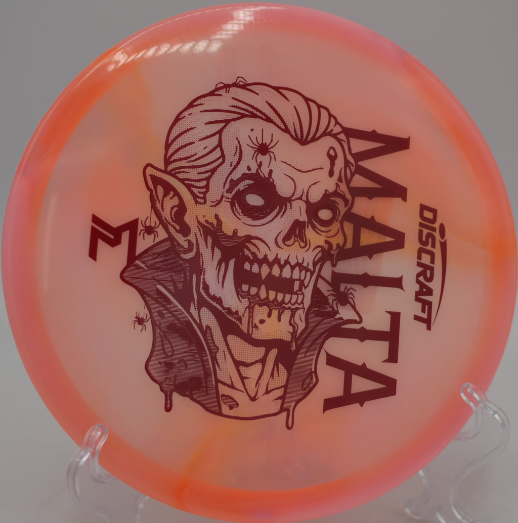 Player shaping a precise approach with the McBeth Dracul Malta at Barnett Park Disc Golf Course in Orlando, Florida.