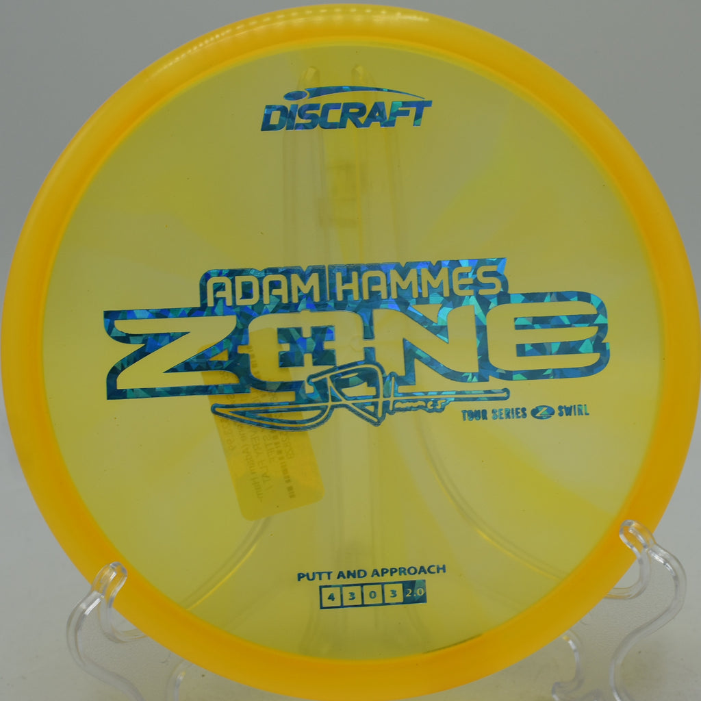 2025 Z-Swirl Zone Adam Hammes signature edition landing flat under the basket at Northwood Black Disc Golf Course in Morton, Illinois.