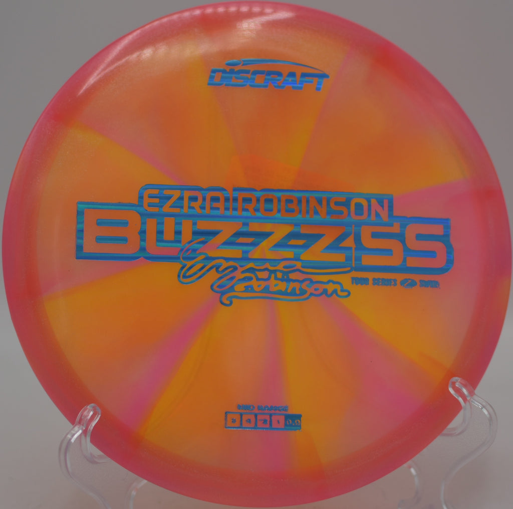 Discraft Ezra Robinson Z Swirl Buzzz SS 2025 flying flat with control at Fountain Hills Disc Golf Course in Fountain Hills, Arizona.