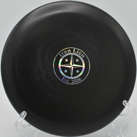 Big Bead Aviar Driver floating toward the pin on a slight hyzer at Hornets Nest Park in Charlotte, North Carolina.