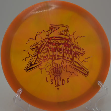 Bright Z Swirl Xtreme finishing with strong fade beside the basket at Hornets Nest Disc Golf Course in Charlotte, North Carolina.