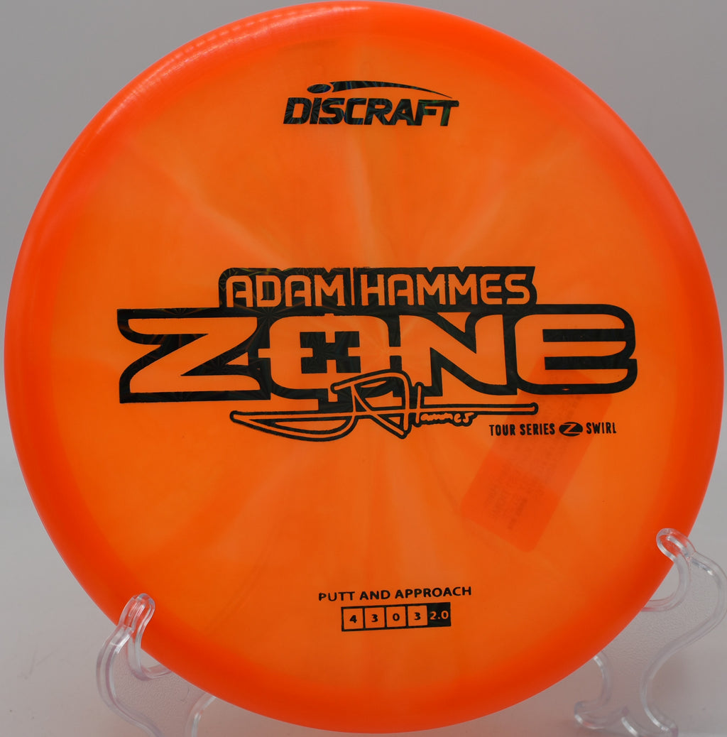 Vibrant Z Swirl Zone gliding downhill at Rollin Ridge Disc Golf Course in Reedsville, Wisconsin.