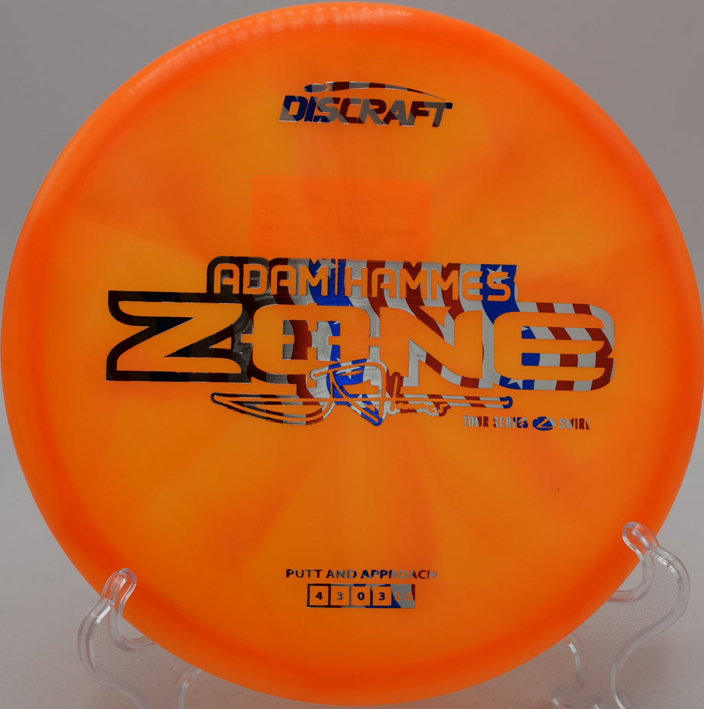 2025 Adam Hammes Z-Swirl Zone approach disc glowing with swirls while parking approaches at Winthrop Gold Disc Golf Course in Rock Hill, South Carolina.