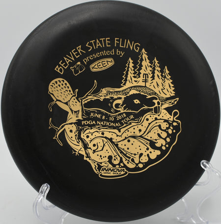 KC Pro Aviar resting near the basket at Brickyard Disc Golf Course in Indianapolis, Indiana.