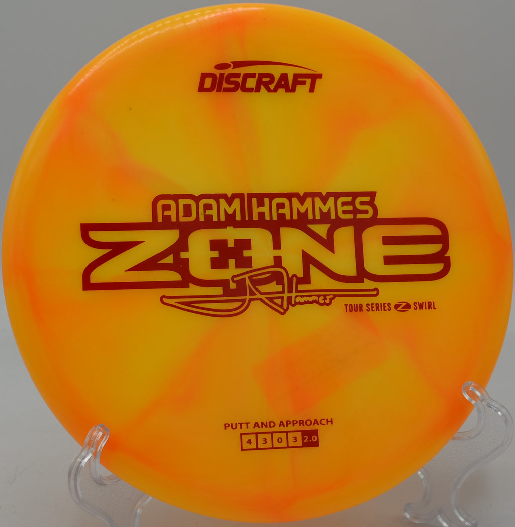 Player holding a green Z Swirl Zone on Hole 1 tee pad at Hawk Hollow in Spotsylvania, Virginia.