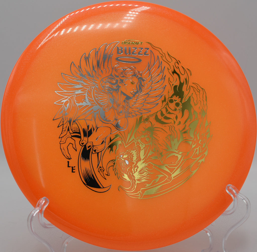 Discraft Colorshift Z Glo Buzzz resting on the fairway at Maple Hill Disc Golf Course in Leicester, Massachusetts, with premium plastic and stable flight performance.