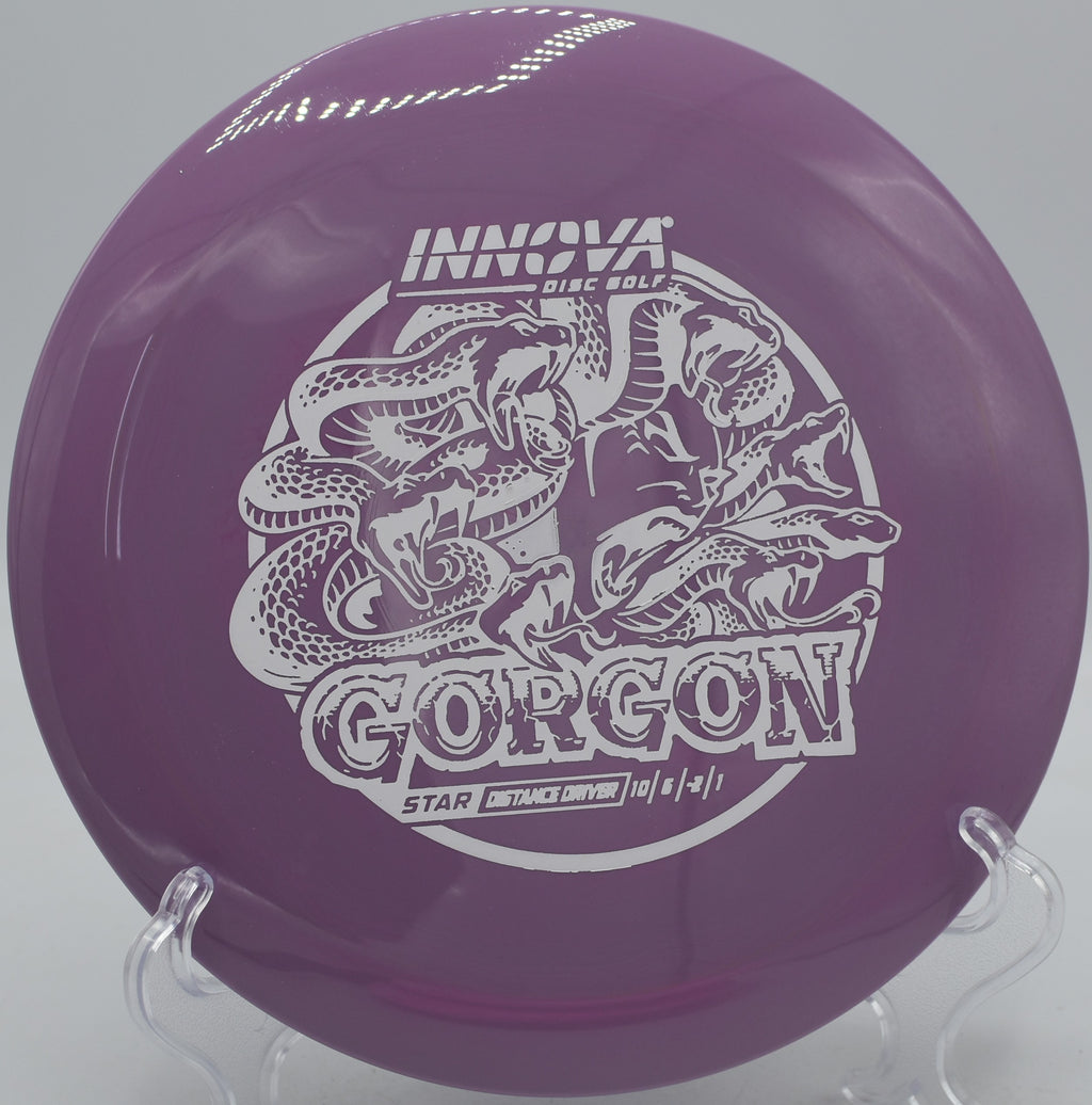 Disc golfer throwing a smooth hyzer with a Star Gorgon at Milo McIver State Park in Estacada, Oregon