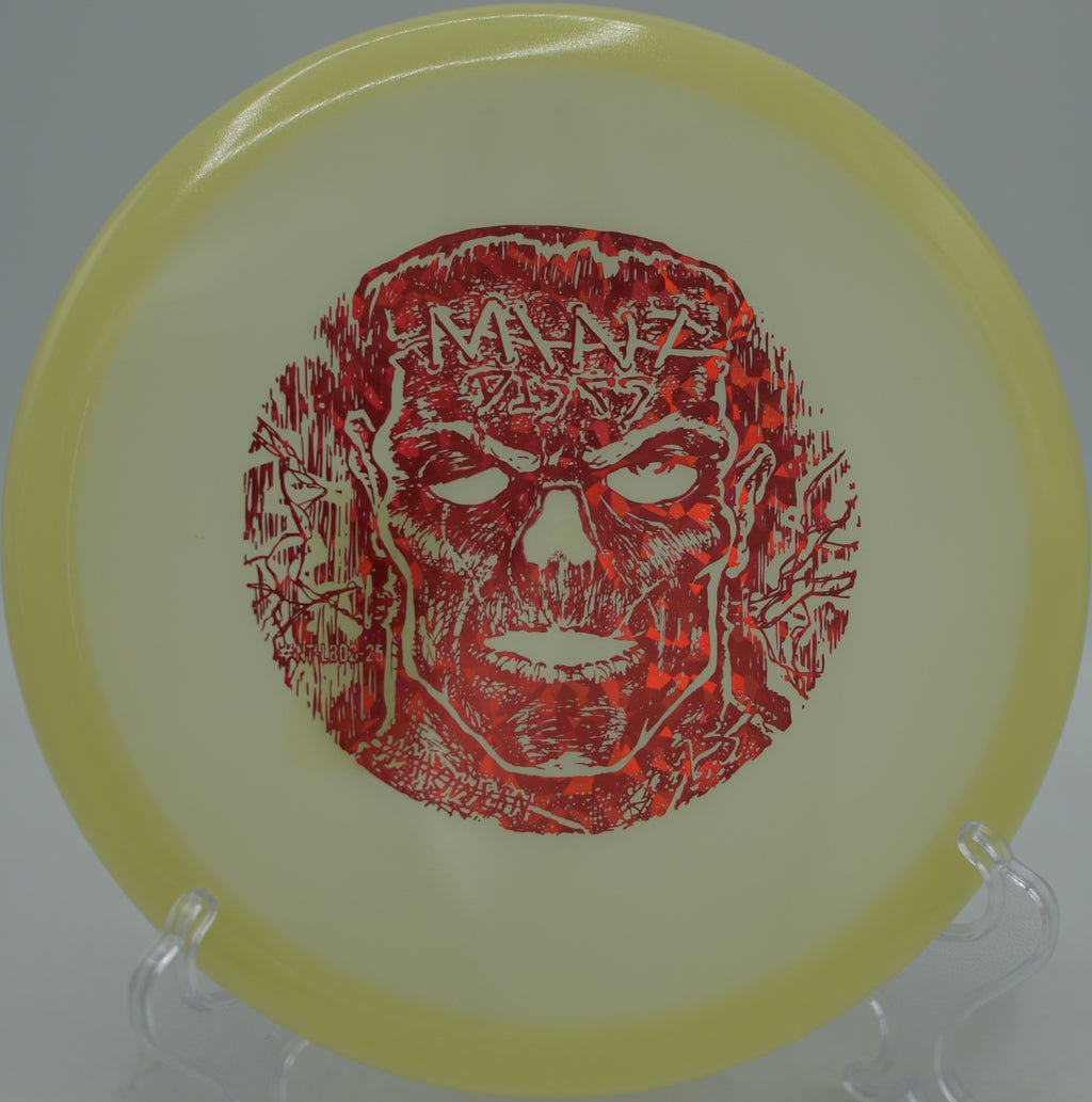 Halloween artwork glowing on the Mint Lobster during a night throw at Rocklin Disc Golf Course in Rocklin, California.
