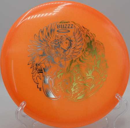 Discraft Colorshift Buzzz glowing against a twilight backdrop at Winthrop Gold in Rock Hill, South Carolina, trusted for night rounds and line-holding consistency.