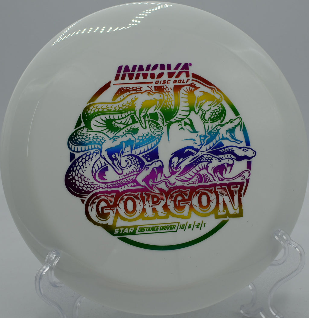 Close-up of Star Gorgon mid-flight over wooded fairway at DeLaveaga Disc Golf Course in Santa Cruz, California