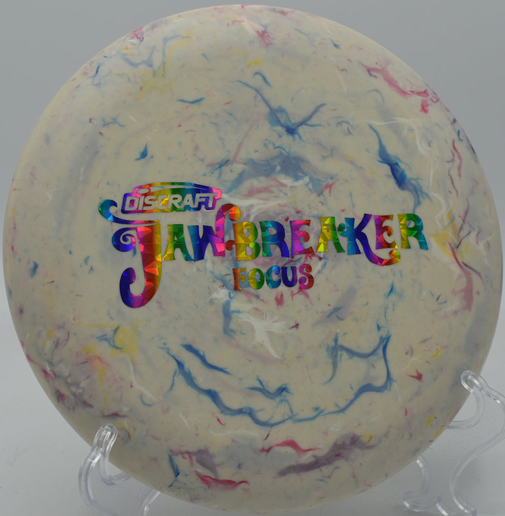 Colorful Jawbreaker Focus spinning low over grass at Winthrop Arena in Rock Hill, SC.