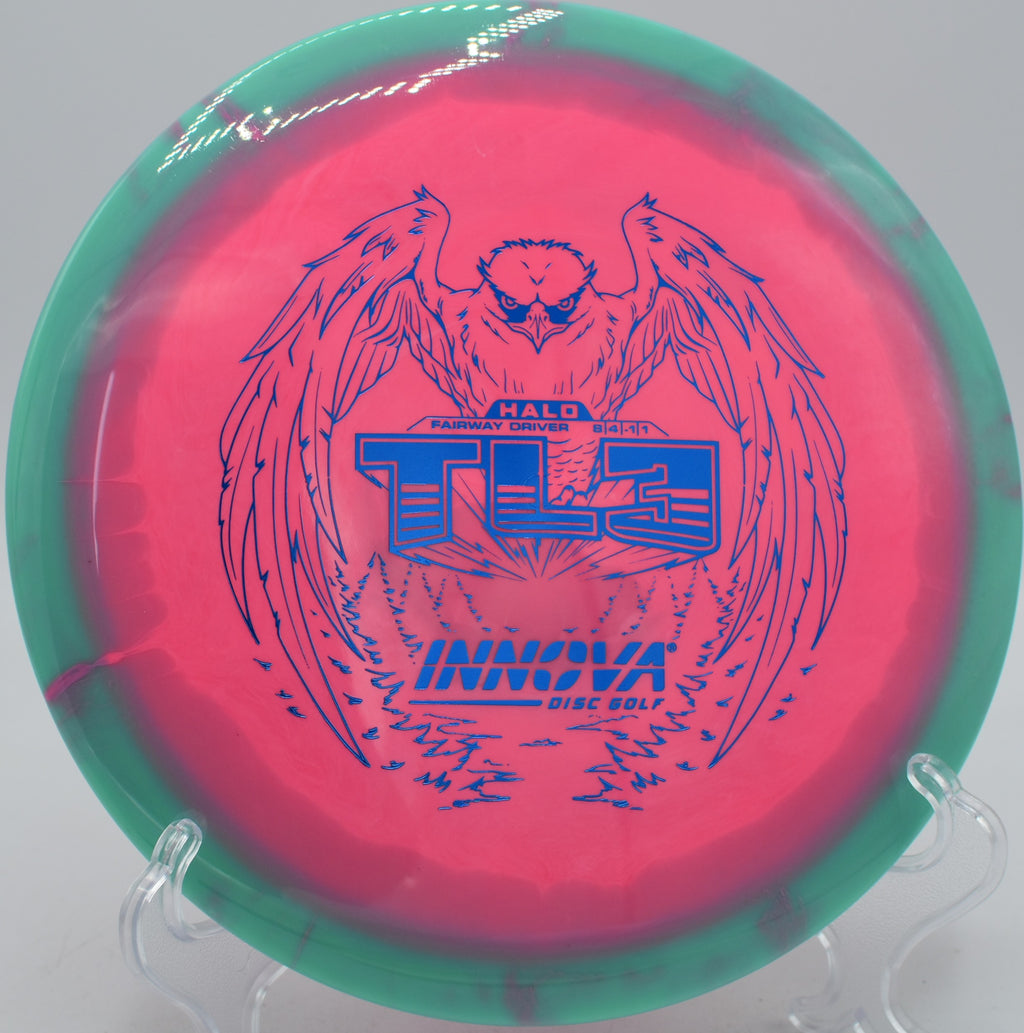Innova Halo Star TL3 disc holding a straight hyzer-flip at Blue Ribbon Pines Disc Golf Course in East Bethel, Minnesota