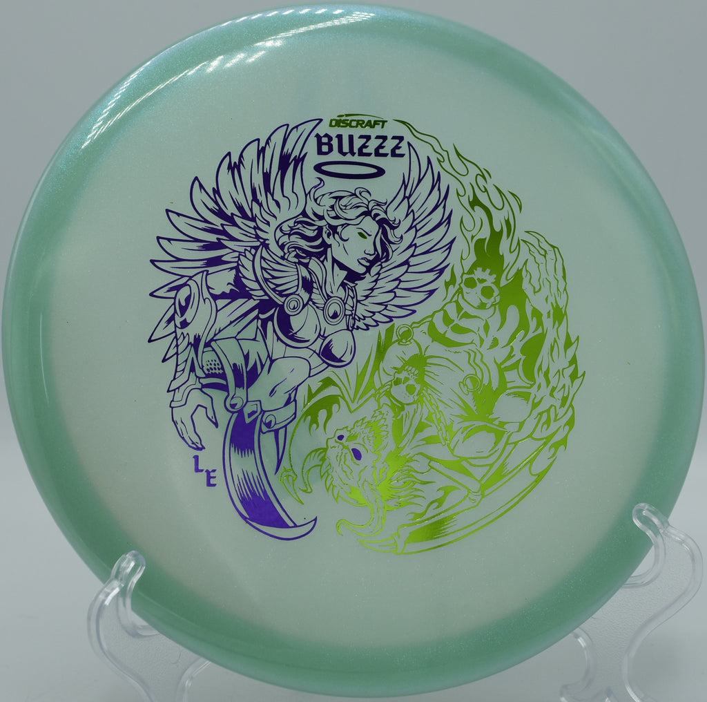 Discraft Colorshift Z Glo Buzzz midrange released on an anhyzer line at Flip City Disc Golf Park in Shelby, Michigan, showing off its shape-holding reliability.