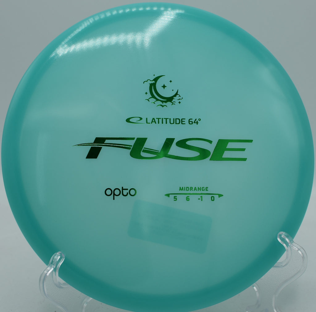 Latitude 64° Opto Moonshine Fuse glowing midrange carving a smooth turnover at Maple Hill Disc Golf Course in Leicester, Massachusetts.