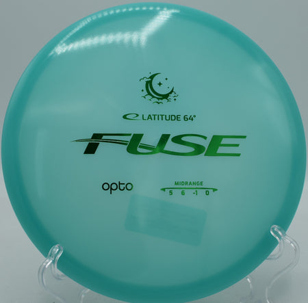 Latitude 64° Opto Moonshine Fuse glowing midrange carving a smooth turnover at Maple Hill Disc Golf Course in Leicester, Massachusetts.