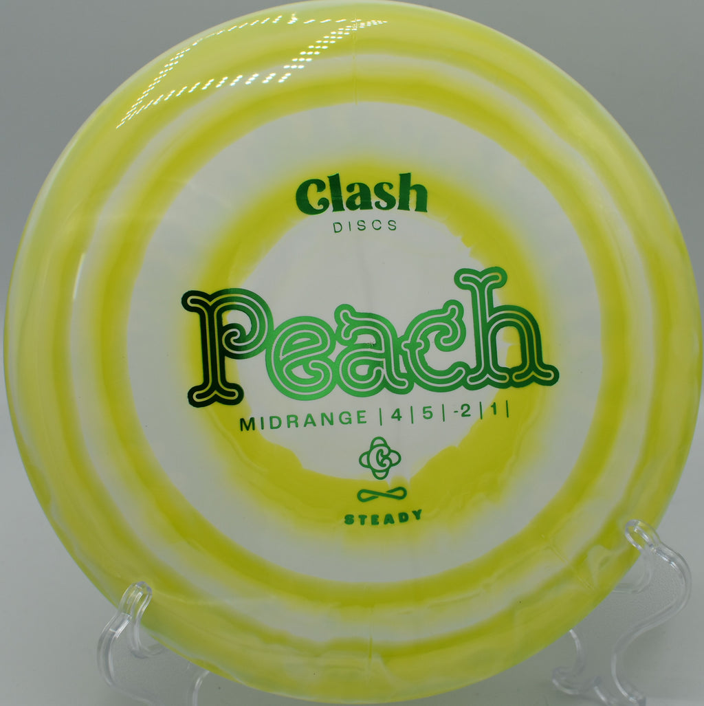 Clash Discs Steady Ring Peach settling under the basket on Hole 12 at The Bear Disc Golf Course, Hickory, North Carolina.
