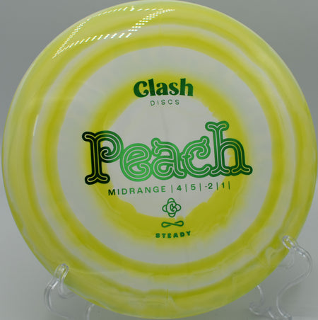 Clash Discs Steady Ring Peach settling under the basket on Hole 12 at The Bear Disc Golf Course, Hickory, North Carolina.