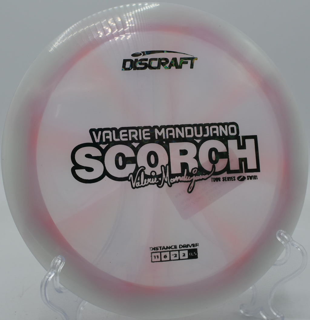 Discraft Z Swirl Scorch soaring through tight trees at Camp Sekani in Spokane, Washington.