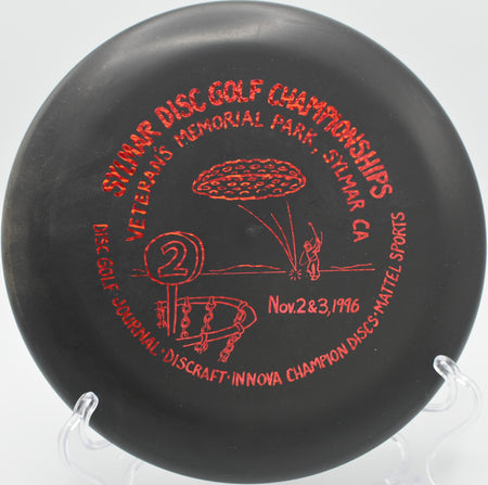 Innova Microbead Aviar spinning smoothly through a wooded fairway on Hole 5 at Branson Cedars Disc Golf Course, Ridgedale, Missouri.