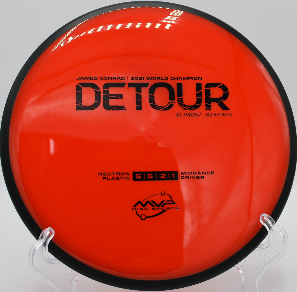 MVP Neutron Detour midrange parked near a hillside green at Moraine State Park in Portersville, Pennsylvania, favored for shaping lines with minimal fade.