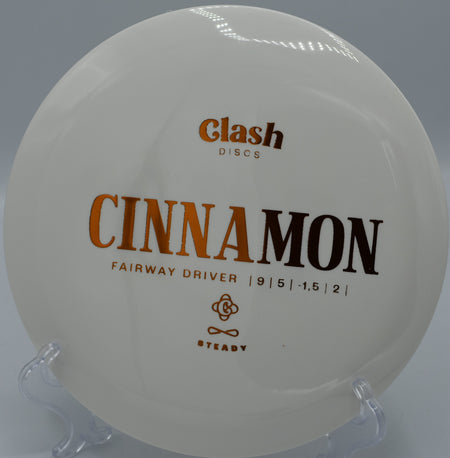 Clash Discs Steady Cinnamon holding a flex shot on Hole 5 at Rolling Pines Disc Golf Course, Wilkesboro, North Carolina.