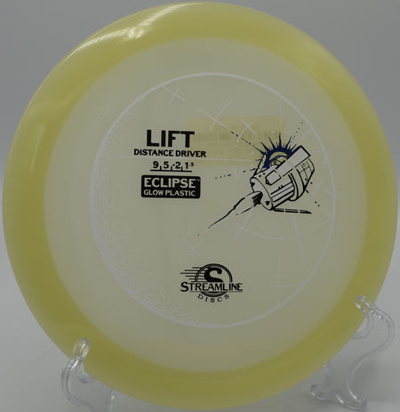 Eclipse Lift disc glowing brightly on the green at Tall Firs Disc Golf Course in Monroe, Washington.
