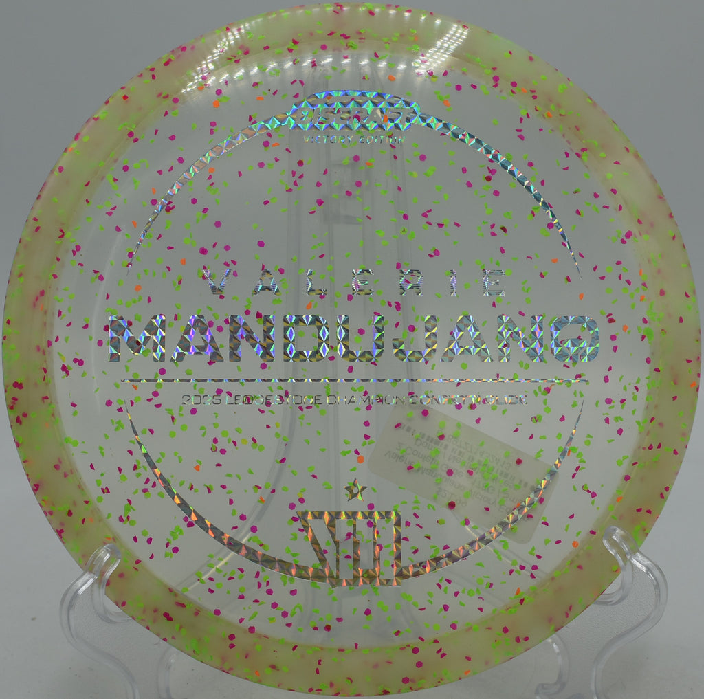 Discraft Z Glide speckled with confetti flying turnover at Northwood Black in Morton, Illinois