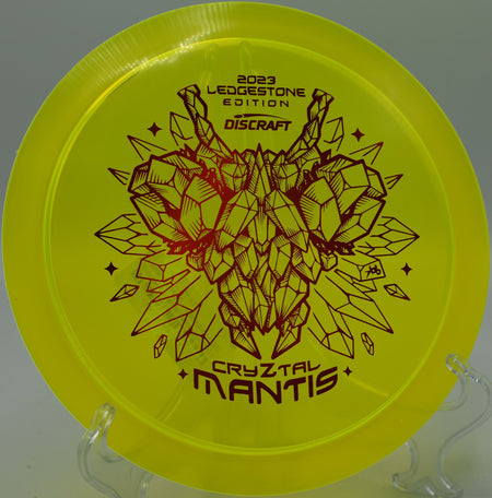 Discraft CryZtal Mantis soaring on a controlled hyzer shot on Hole 5 at Heritage Park Disc Golf Course, Adrian, Michigan.