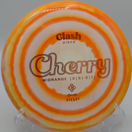 Clash Discs Steady Ring Cherry settling under the basket on Hole 12 at The Bear Disc Golf Course, Hickory, North Carolina.