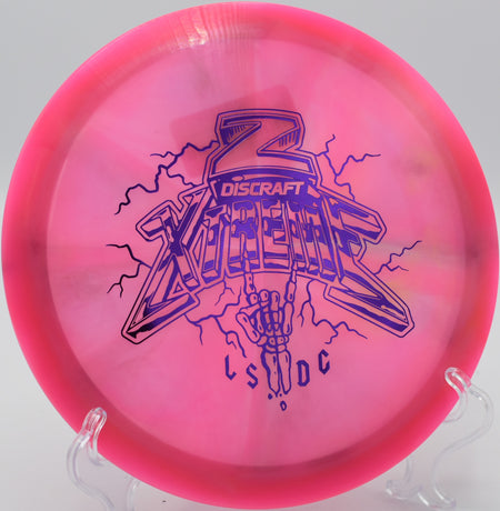 Discraft Xtreme Z Swirl Ledgestone Edition flying on a powerful forehand flex line at Maple Hill Disc Golf Course in Leicester, Massachusetts.