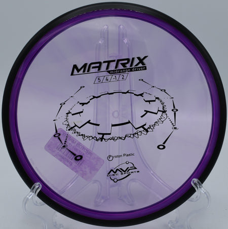 An MVP Proton Matrix flying straight down the fairway at Hornets Nest Disc Golf Course in Charlotte, North Carolina.