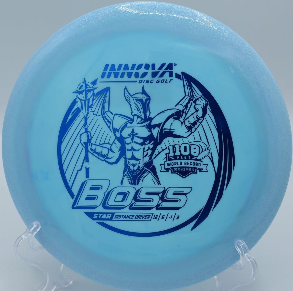 Innova Star Boss high-speed distance driver ripping a max flex line at Maple Hill Disc Golf Course in Leicester, Massachusetts