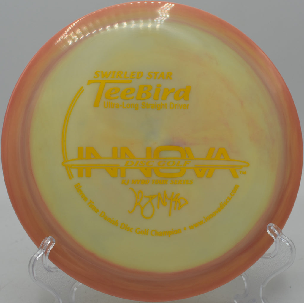 Stable Swirly TeeBird flying low and straight at Flip City Disc Golf Park in Shelby, Michigan