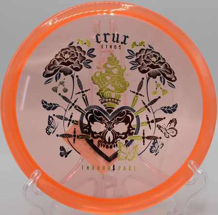 Thought Space Athletics Ethos Crux spinning cleanly through a wooded gap on Hole 10 at Maple Hill Disc Golf Course, Leicester, Massachusetts.