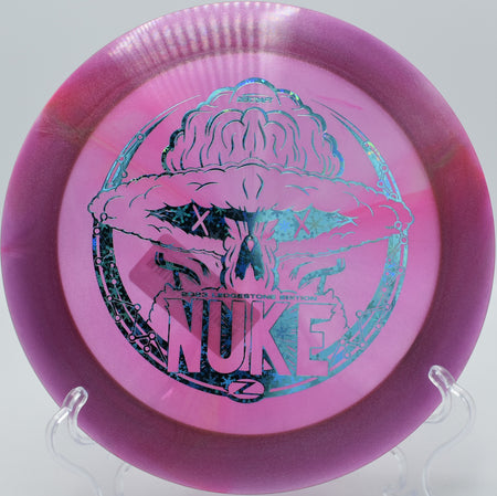 Discraft Z Nuke carving a max-distance S-curve on Hole 3 at Persimmon Ridge Disc Golf Course, Greenbrier, Arkansas.