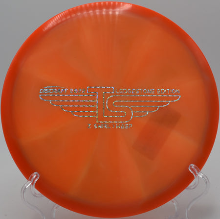 Discraft Z Wasp landing softly on a controlled approach at Hole 18 at Persimmon Ridge Disc Golf Course, Greenbrier, Arkansas.